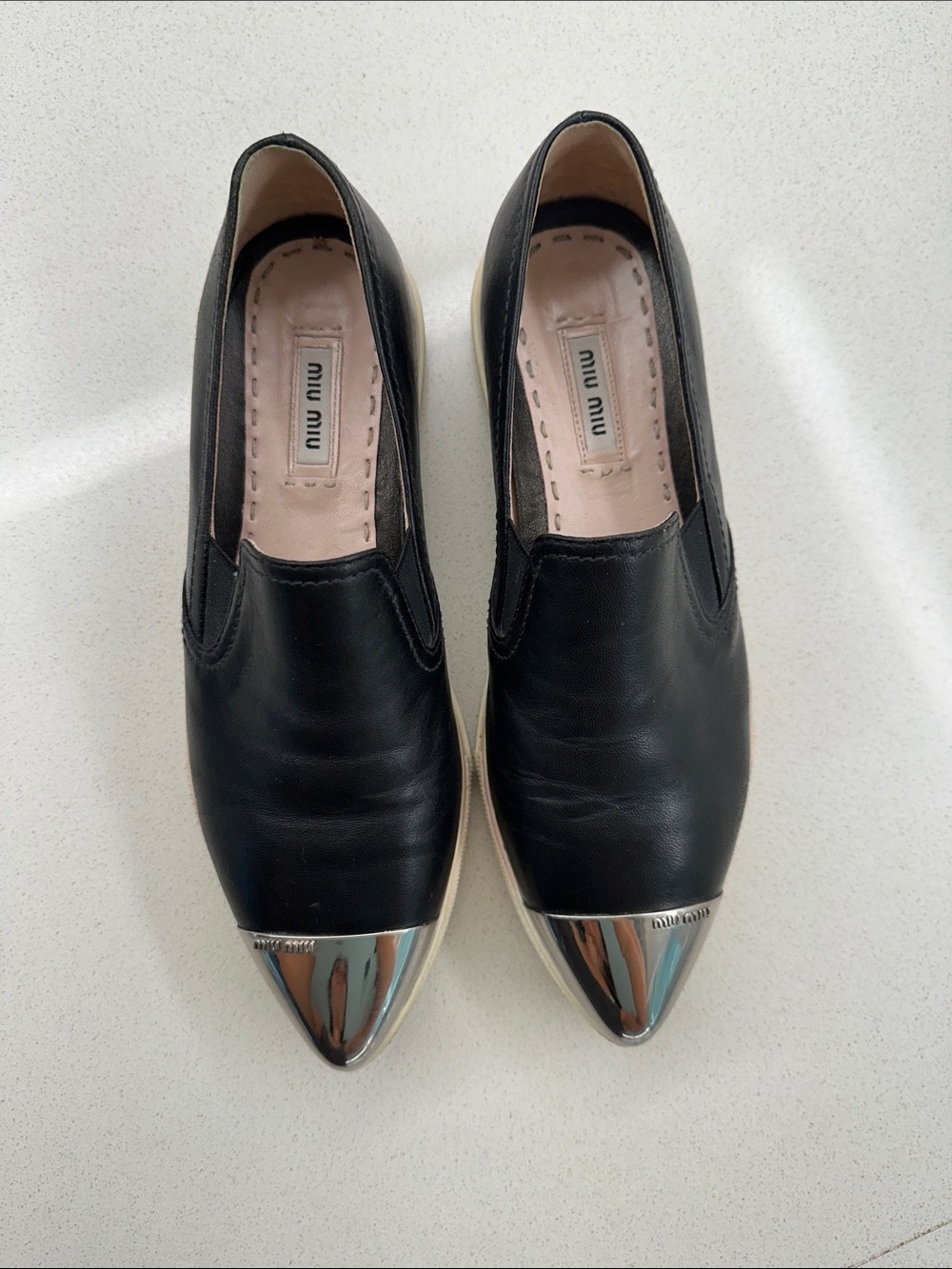 Miu Miu Black Leather Slip-On Flats with Silver Cap Toe